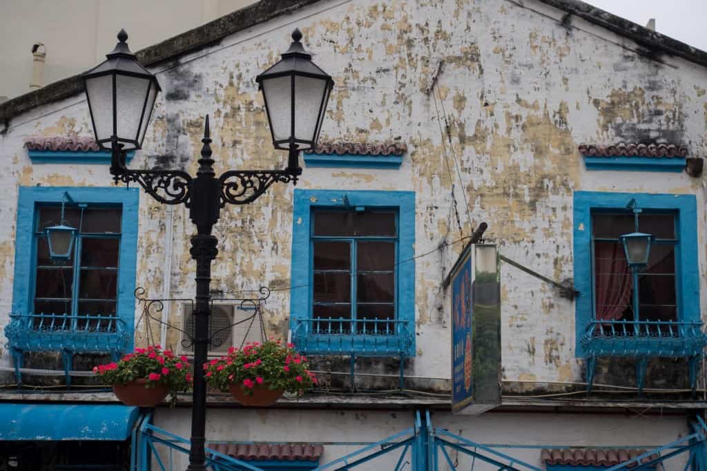 old portuguese style houses and lamp post as seen in the 1 day macau itinerary