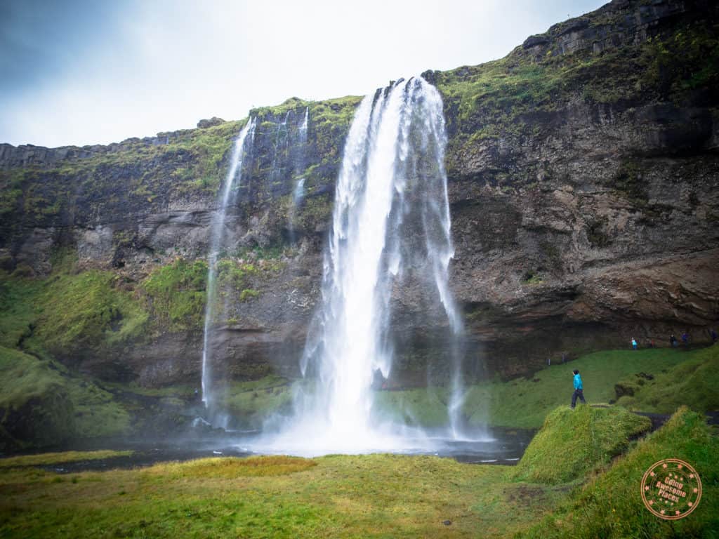 8 day iceland itinerary looking up at seljalandsfoss waterfall
