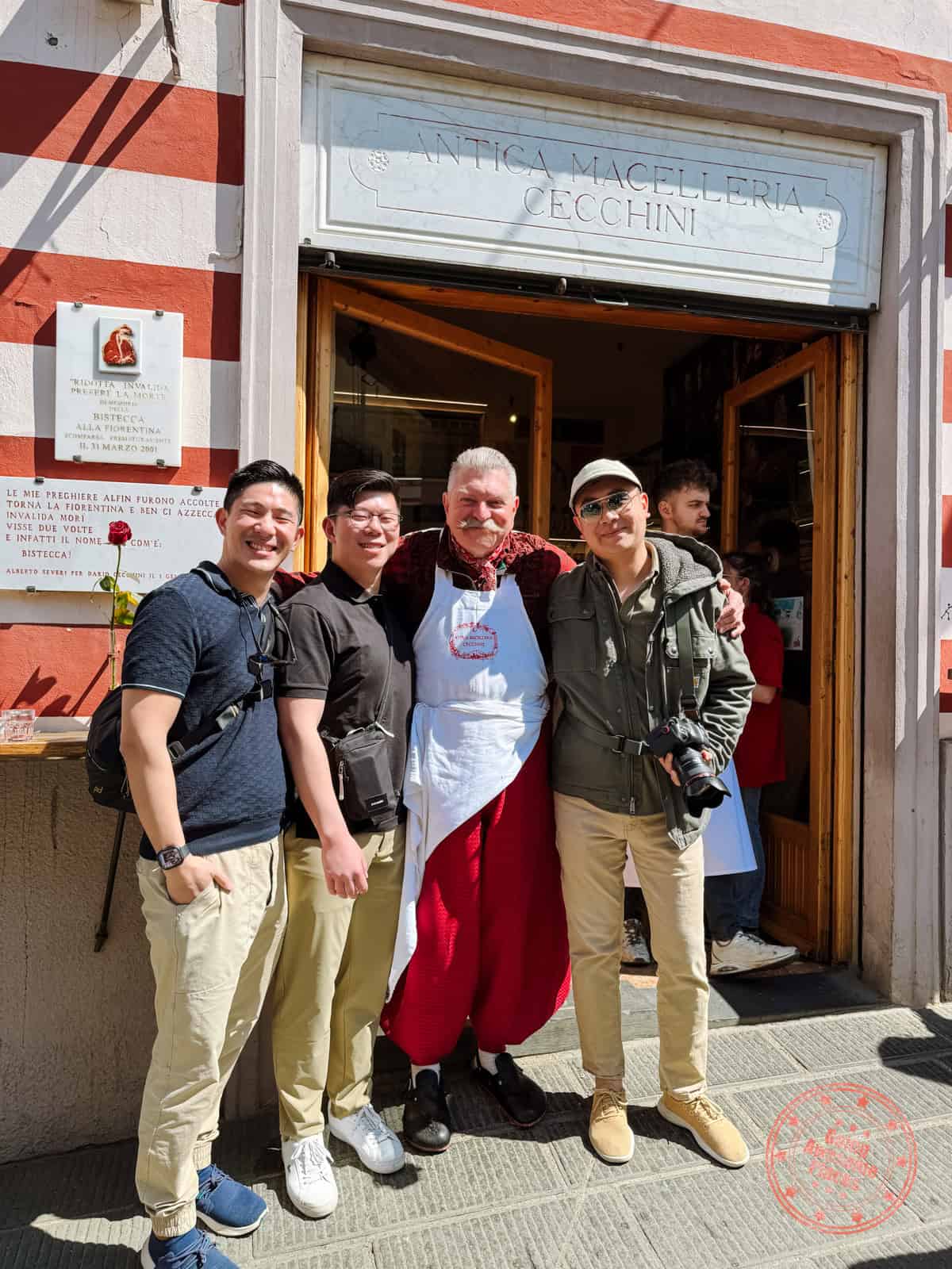 3 asian guys taking photo with dario cecchini