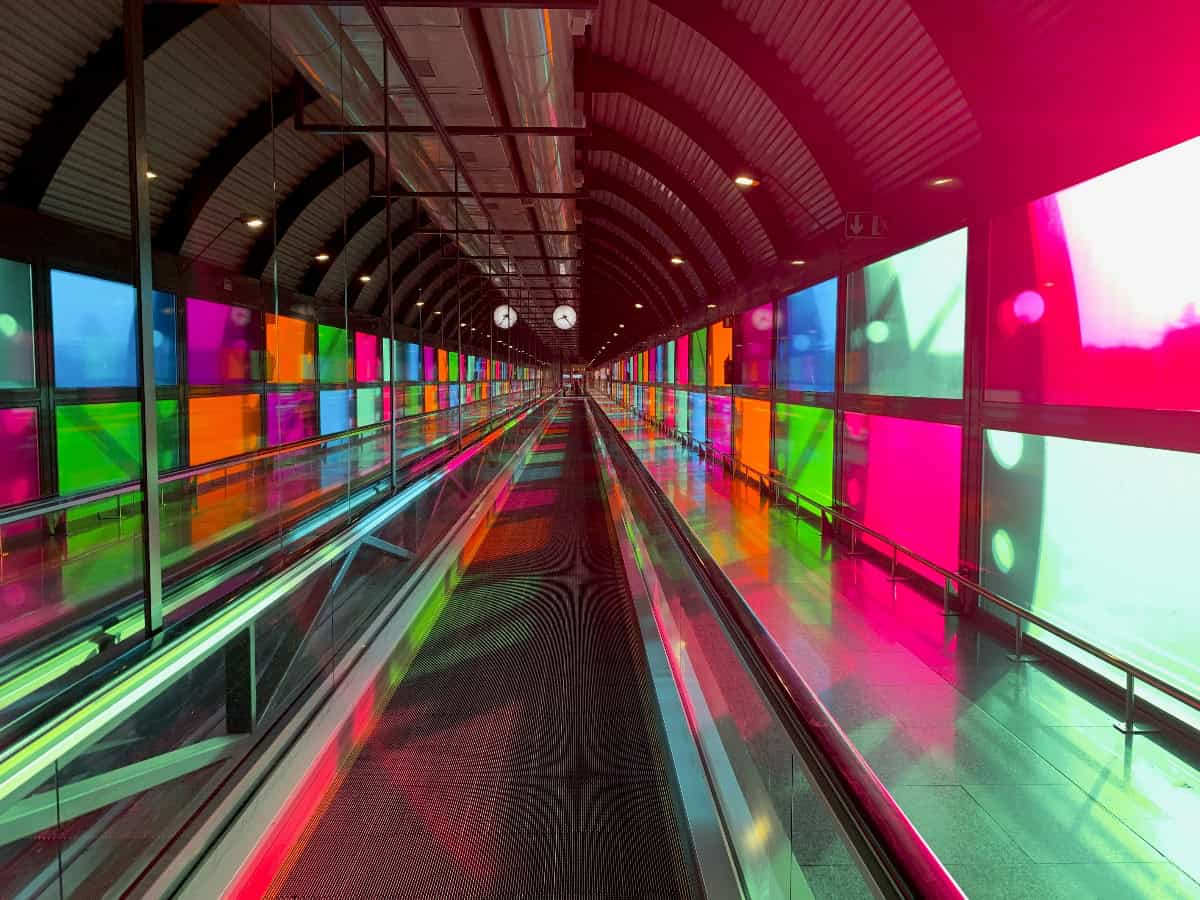 colorful windows in tunnel at adolfo suárez madrid–barajas airport
