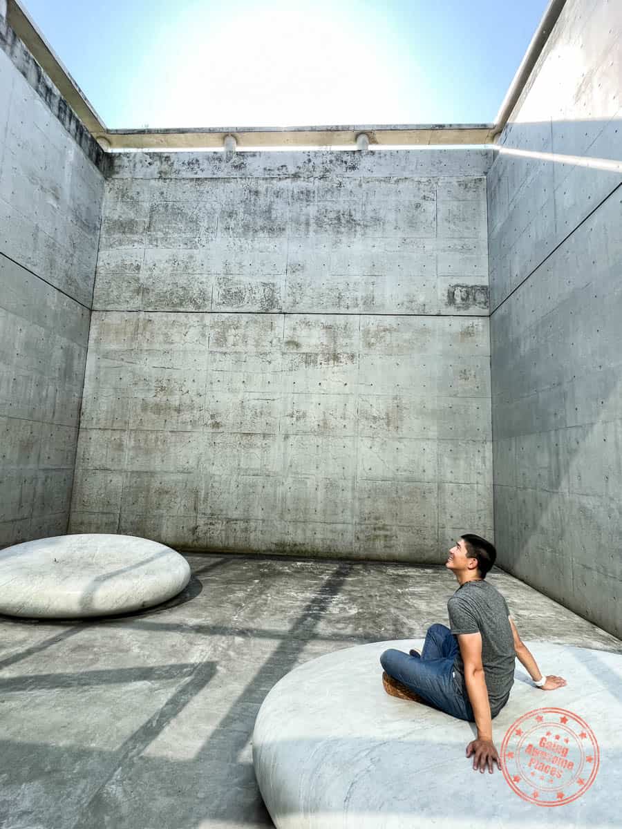 benesse house museum man enjoying kan yasuda's the secret of the sky art installation