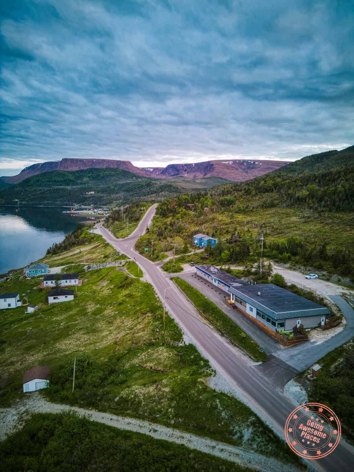 bonne bay inn in woody point with beautiful backdrop of the tablelands as a backdrop