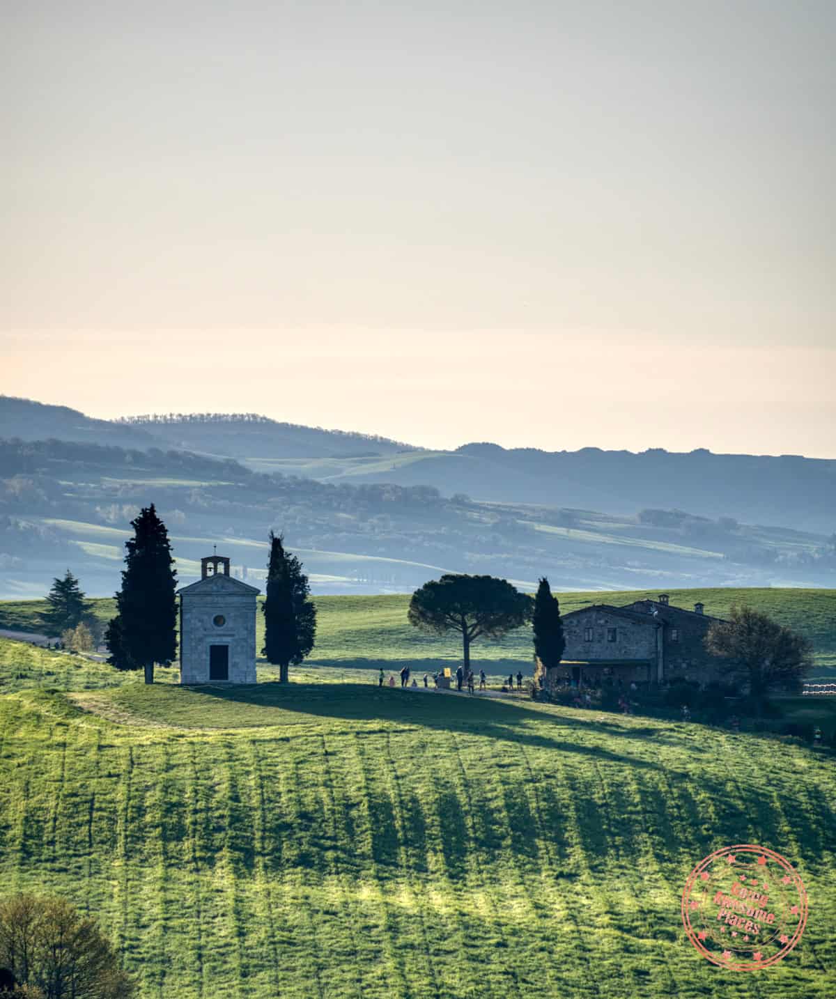 chapel vitaleta in val d'orcia in early morning light