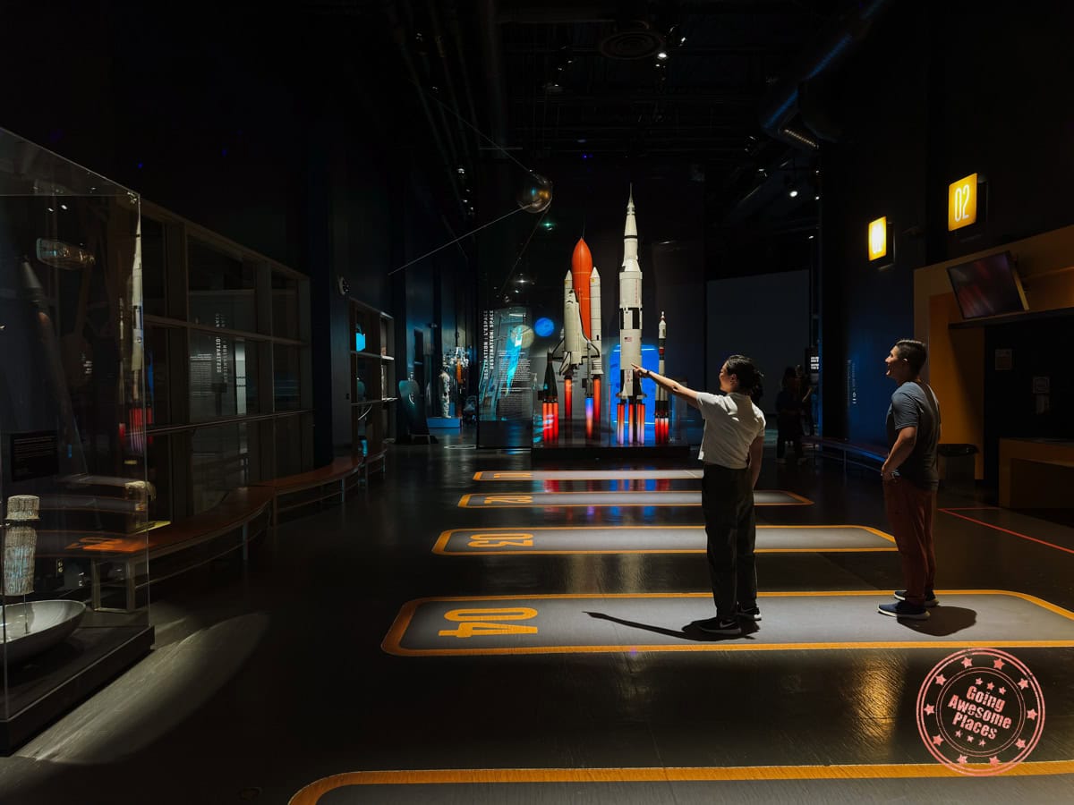 couple looking at cosmodome space ship exhibit