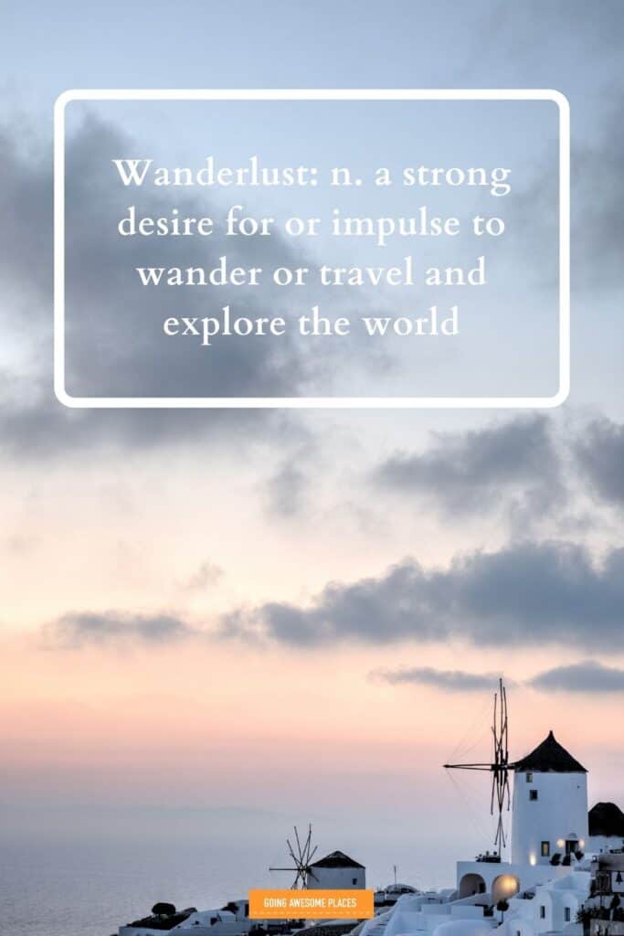 definition of wanderlust with background of oia in santorini travel quote