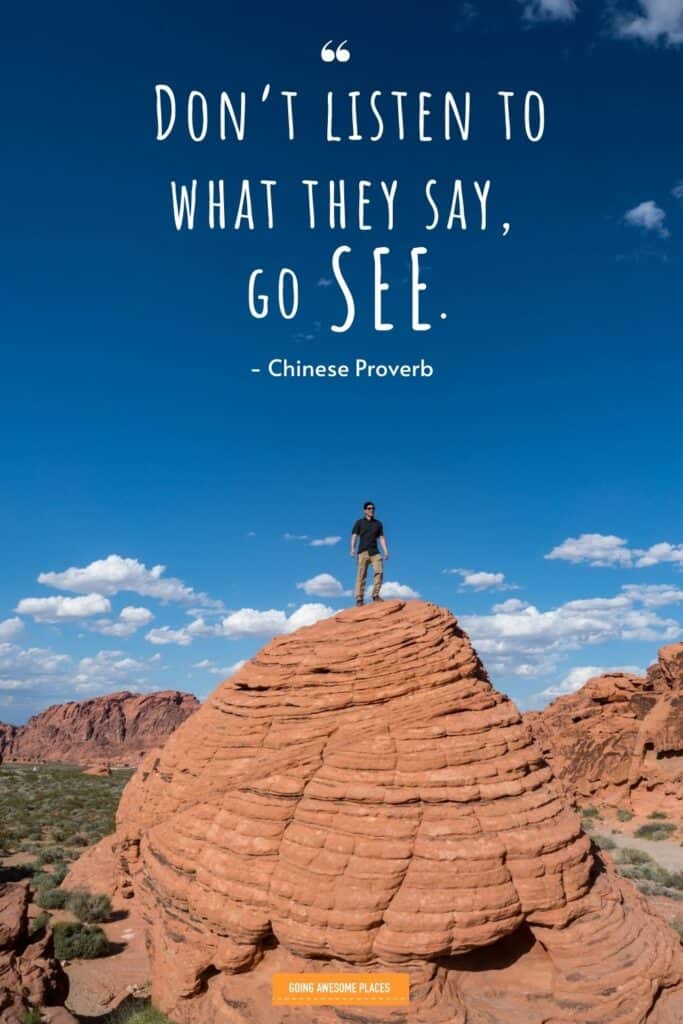 dont listen to what they say go see chinese proverb travel quote with man standing on natural rock mound in nevada