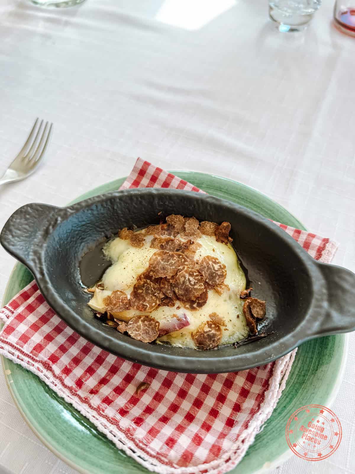 fresh shaved truffle on melted cheese from ristorante c'era una volta
