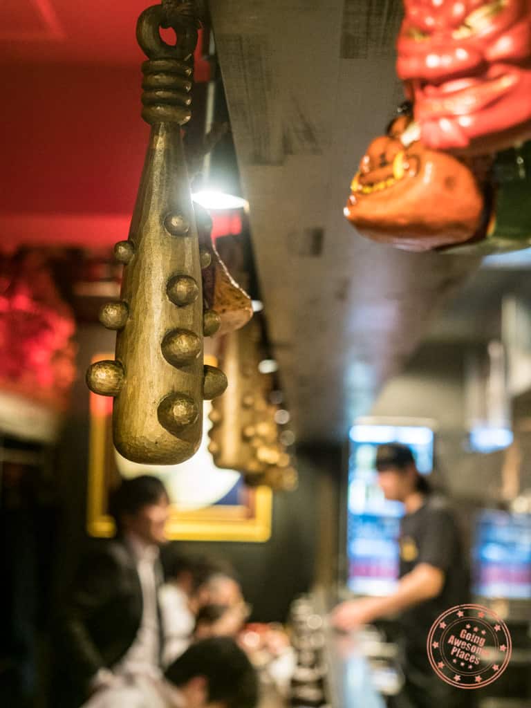 golden spiked bates dangling at kikanbo ramen in tokyo