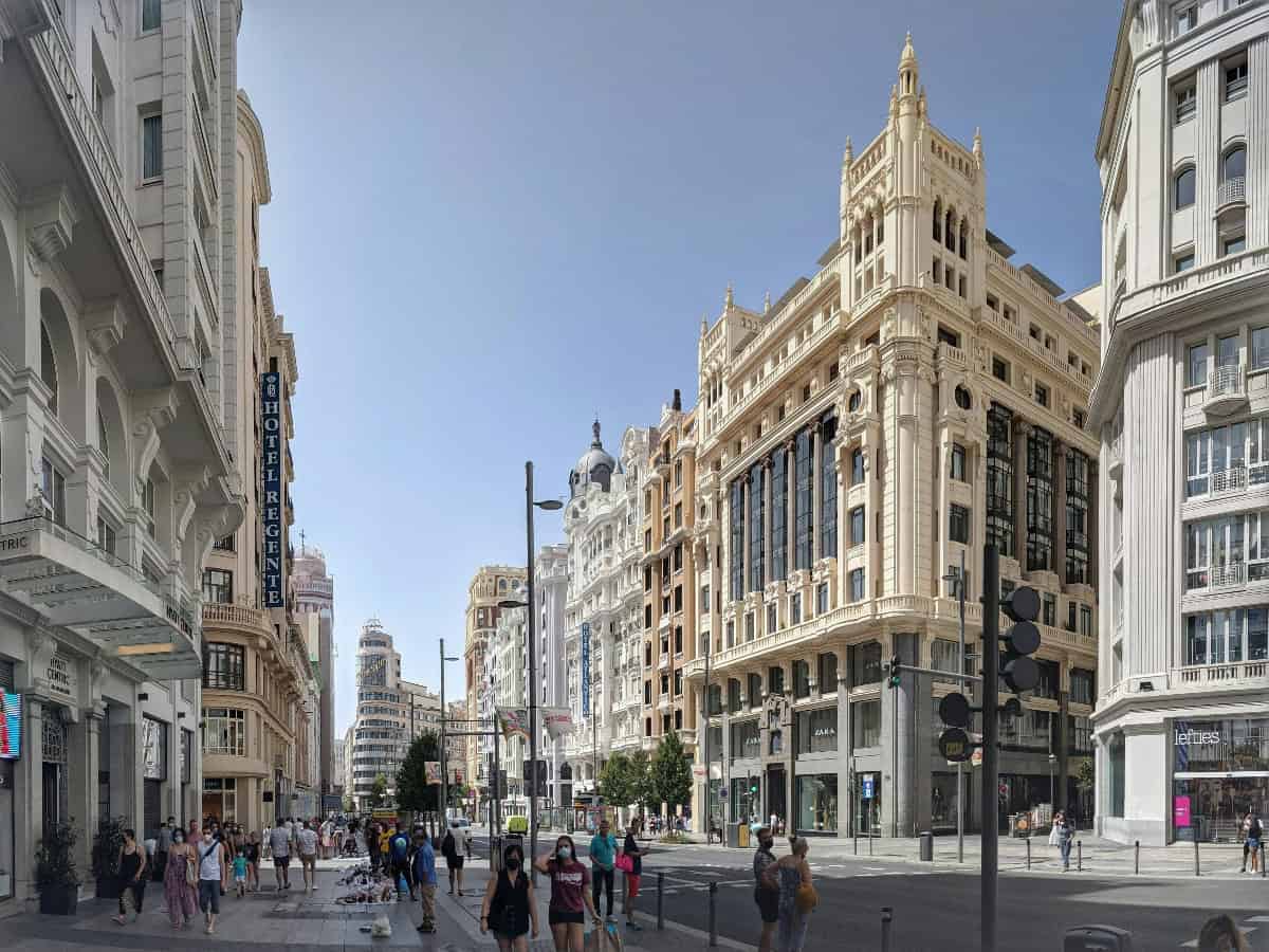 crowd of people strolling around gran vía