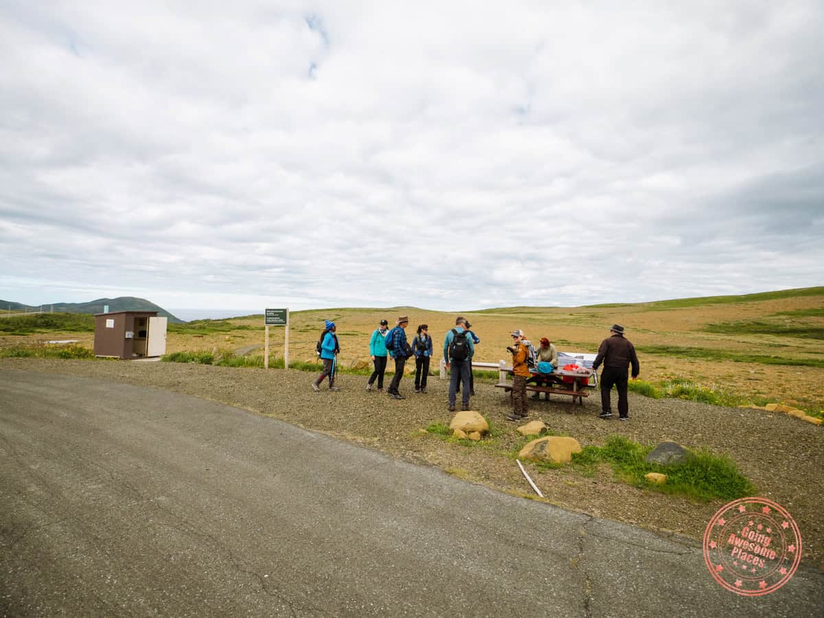 green gardens trailhead area with washroom outhouse