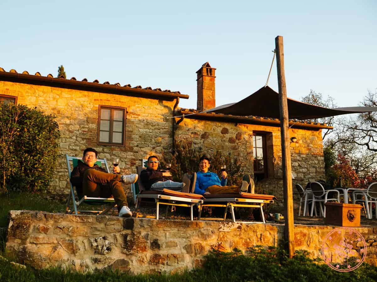 group of guys enjoying terrace at l'oliveta at montebuoni villa