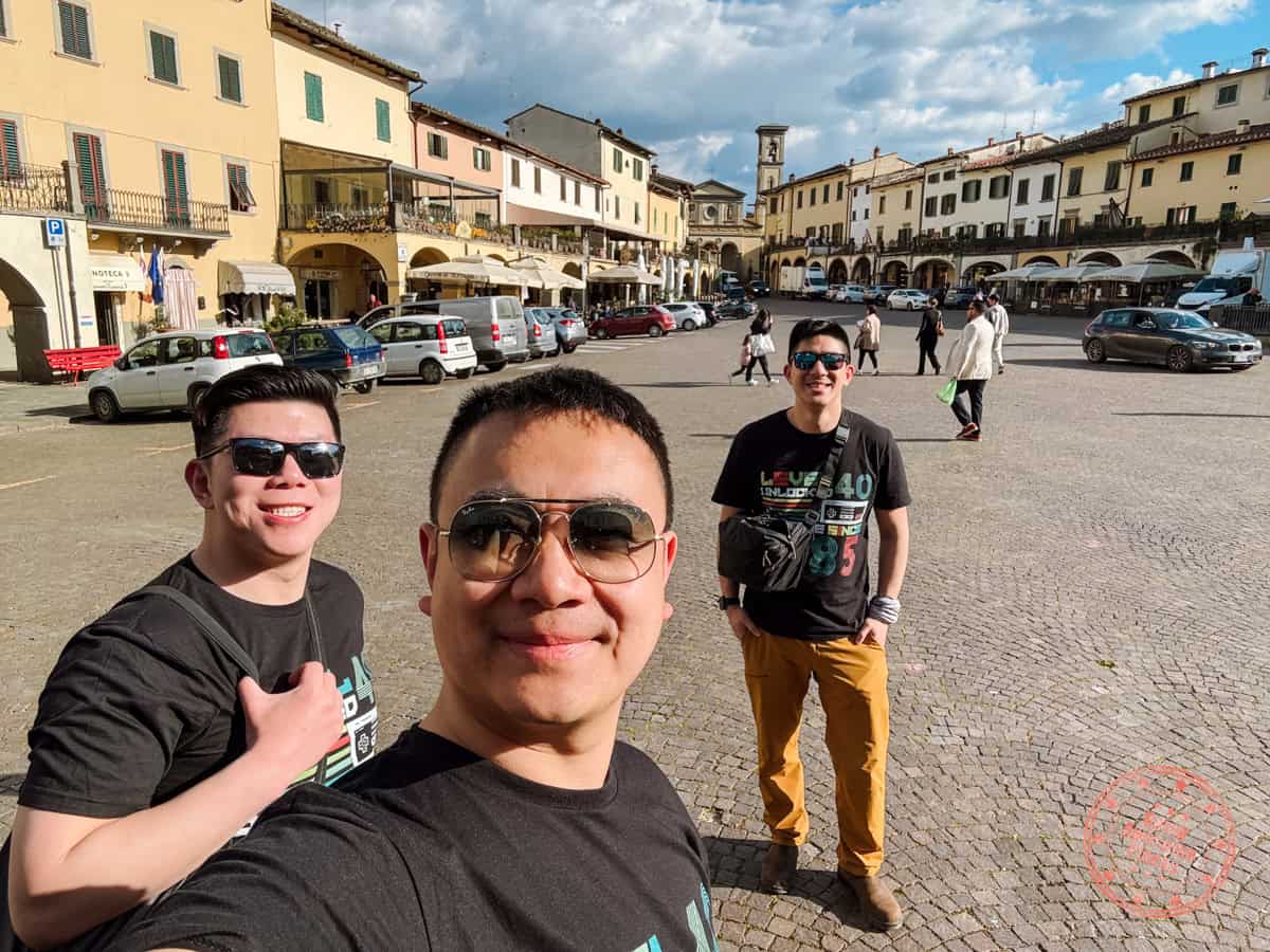 group photo of 3 guys in greve in chianti town square