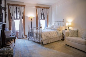 where to stay in new york harlem grand large bedroom with seating and windows