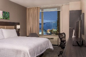 hilton garden inn nyc financial center suite with desk and window view