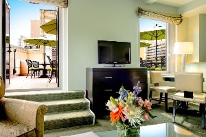 hotel beacon living space with stairs leading out to private terrace