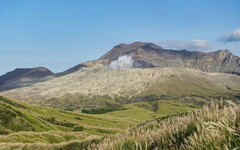 stunning view of mt. aso from across grasslands