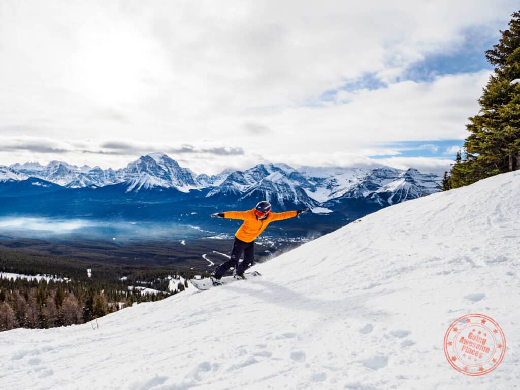 lake louise ski resort snowboarding in yellow jacket