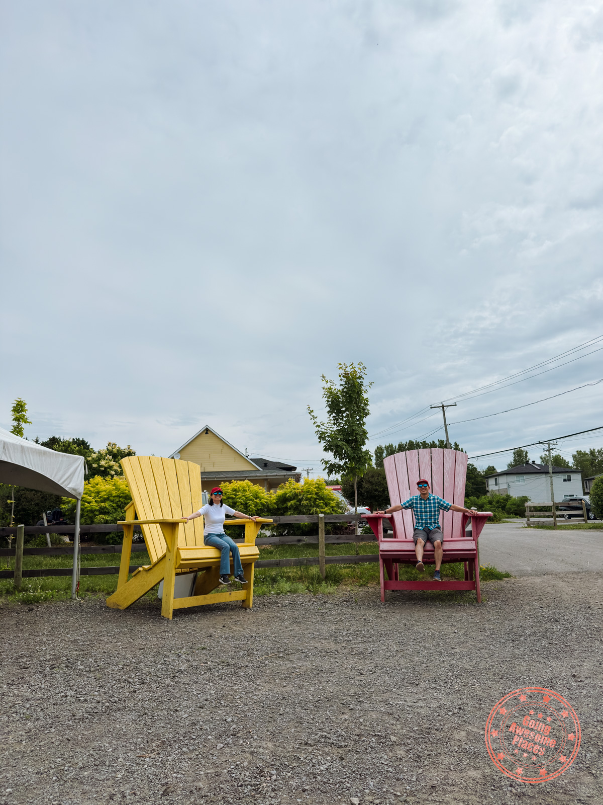 sitting on two large muskoka chairs agneaux de laval