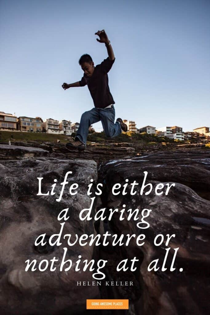 life is either a daring adventure or nothing at all travel quote by helen keller with man leaping over rocks