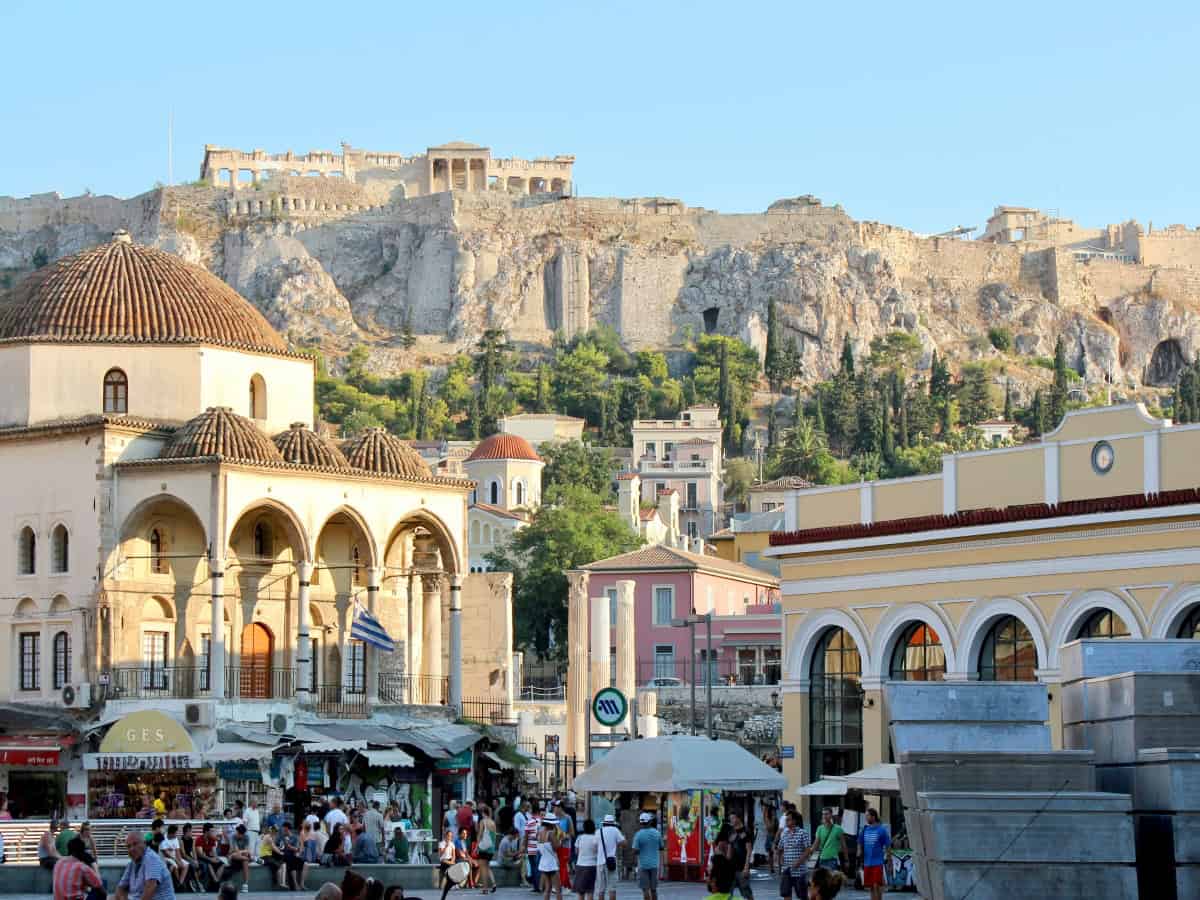 busy street amongst ancient buildings in monastiraki