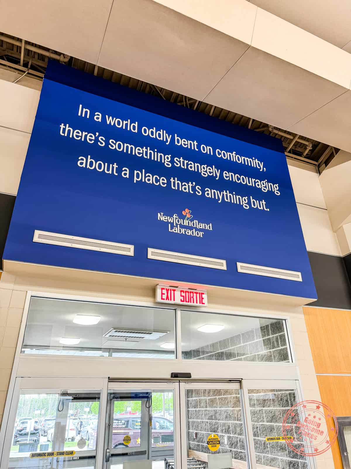 newfoundland tourism board sign with quote on conformity