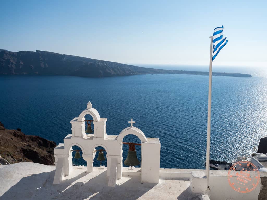 greek islands travel guide oia santorini church flag greece