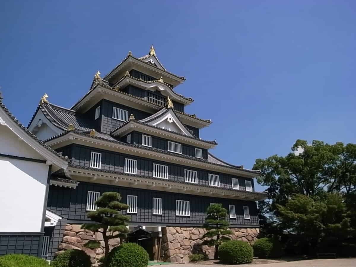 up-close view of the black exterior of okayama castle