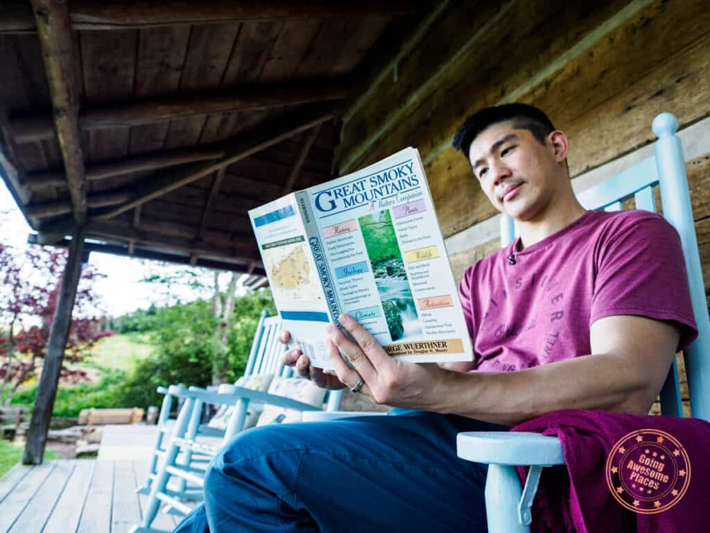 planning a great smoky mountains itinerary while reading at a boyd mountain log cabin
