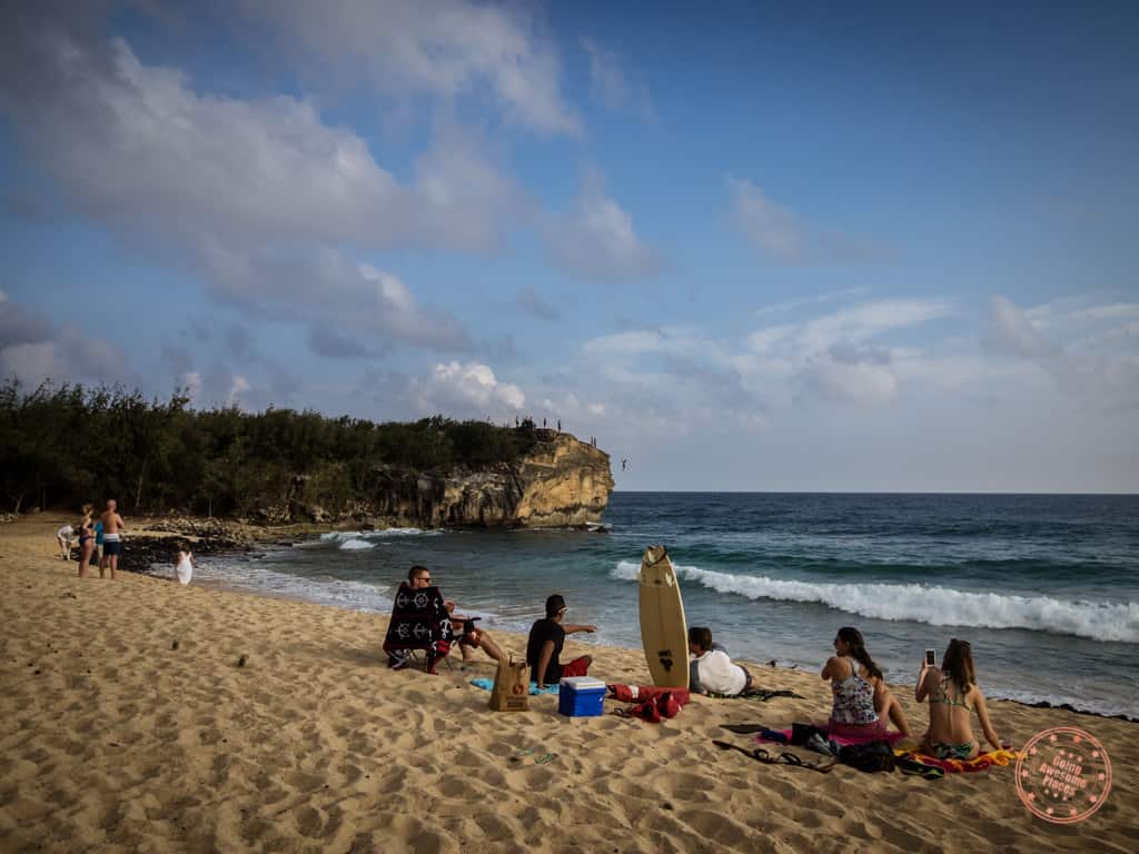 shipwreck beach in poipu south shore of kauai with friends hanging out