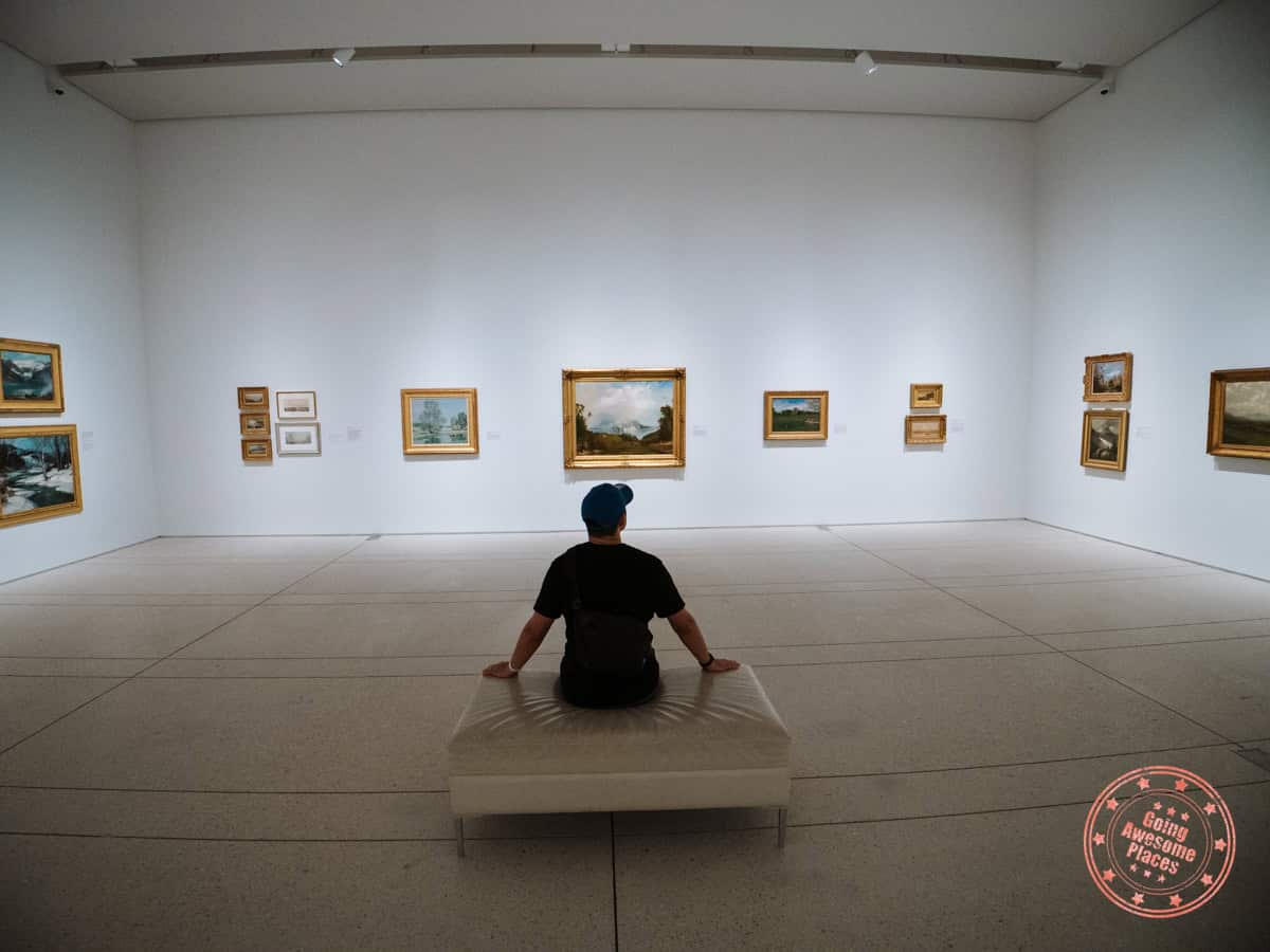 sitting in the gallery of paintings at tampa museum of art