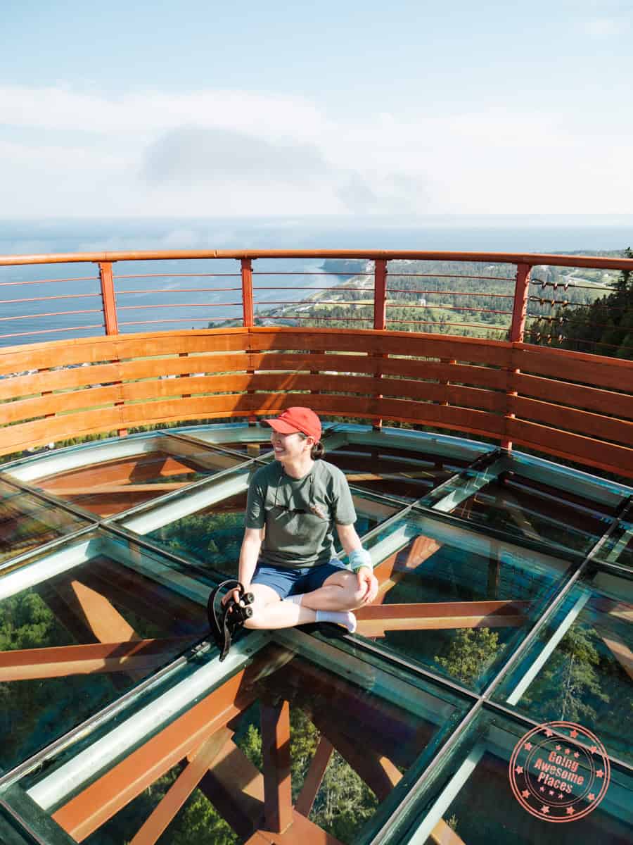 sitting on glass bottom observation deck in perce