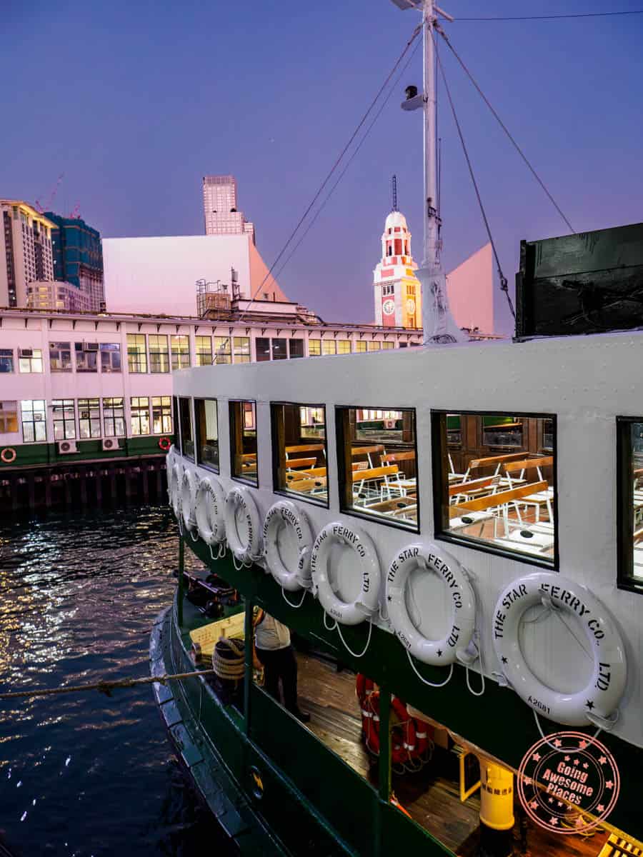 star ferry docked at tsim sha tsui pier at sunset