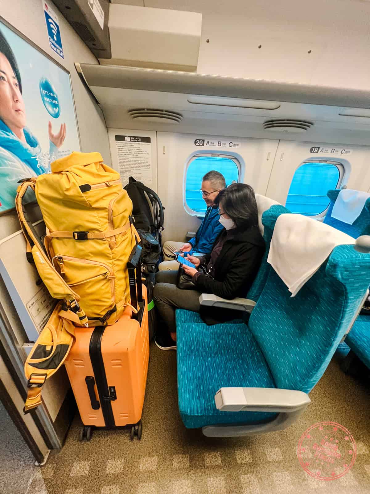 storing luggage on japan on first row while taking train from osaka to kyoto