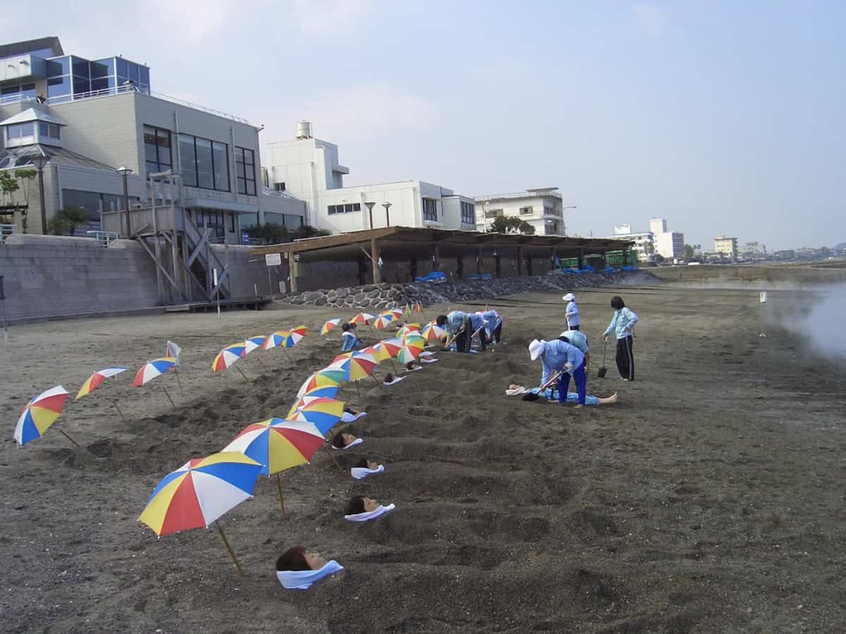 many people enjoying sand baths at surigahama beach