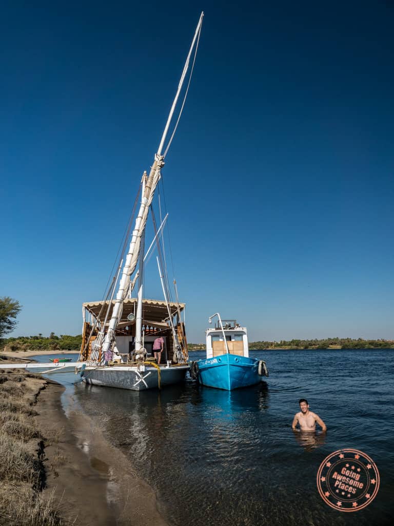 swimming in the nile river with dahabiya djed egypt travel activity
