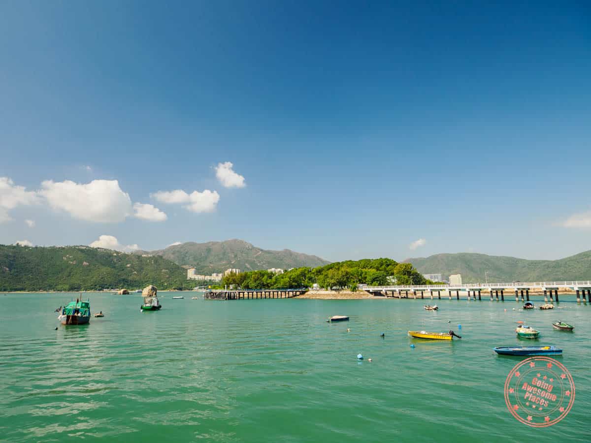 tai lei island connected by a bridge with fishing boats in the water