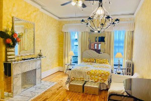 the international cozy inn large room with fireplace and chandelier