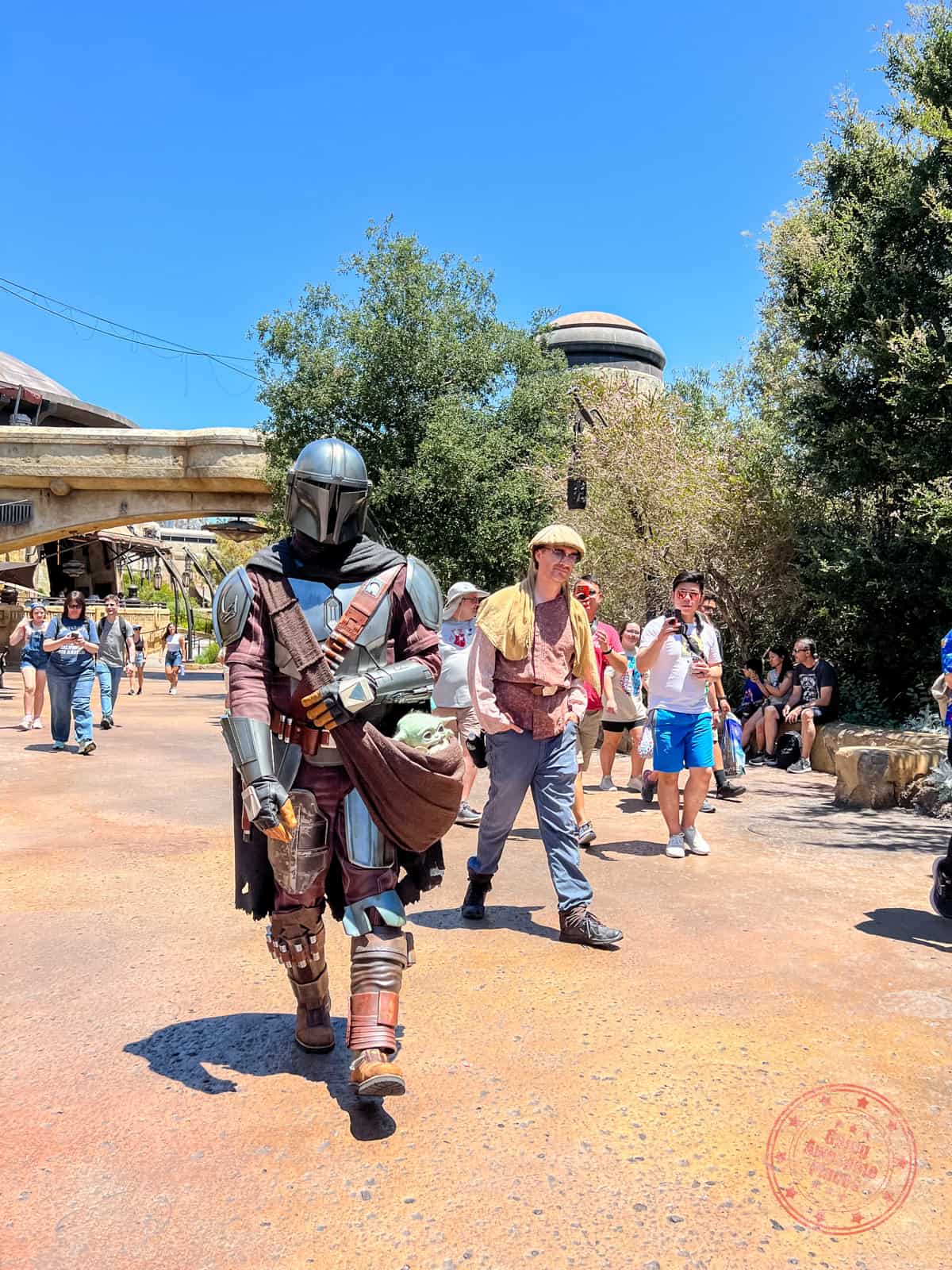 the mandalorian and grogu character interaction in galaxy's edge disneyland