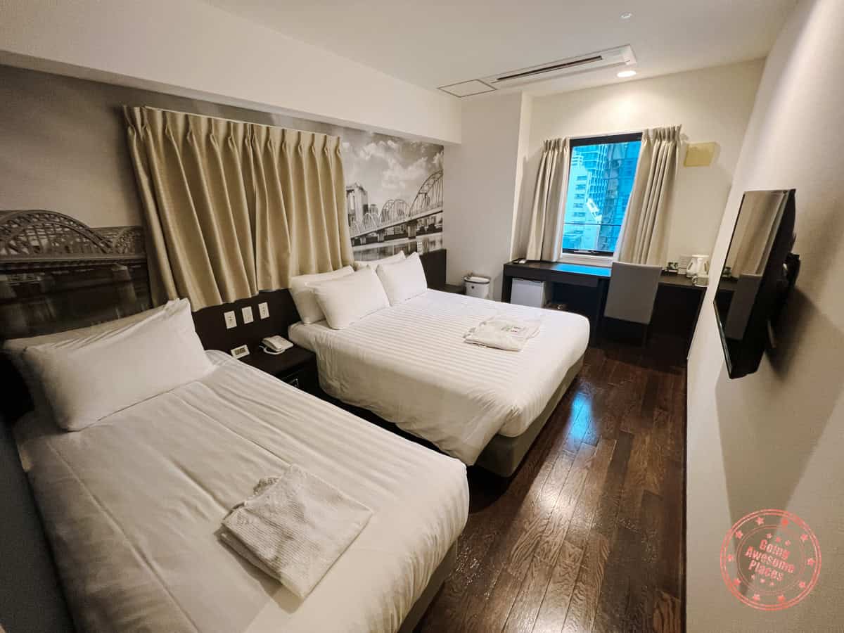 interior bedroom of travelodge honmachi osakak hotel with triple occupancy set up