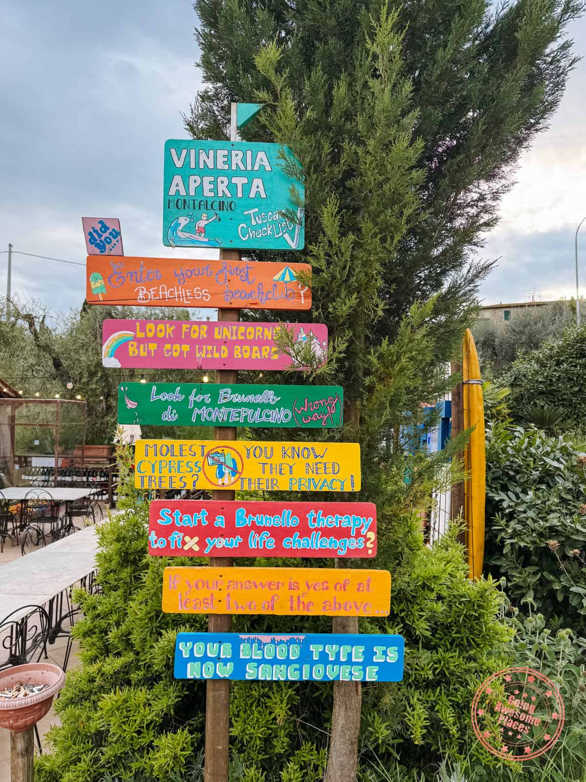 vineria aperta montalcino colorful signs
